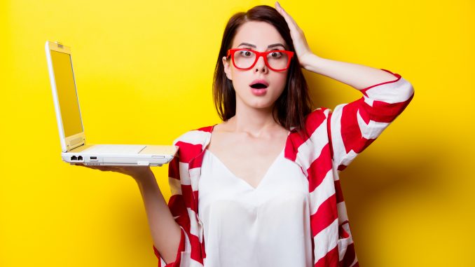 young surprised woman with laptop National Tell a Joke Day