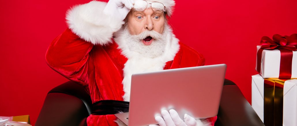 Winter noel december eve christmastime package. Aged mature Santa spectacles open mouth eyes white beard isolated red background look pc wondered astonishment face receive unbelievable email letter Christmas job openings